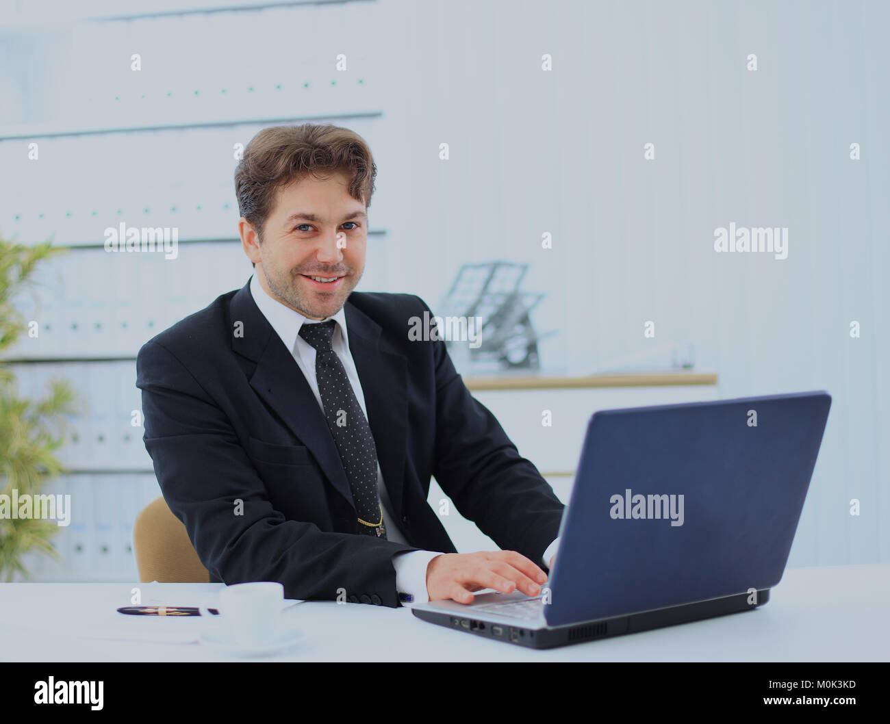 Closeup of employee in the office working on laptop computer Stock ...