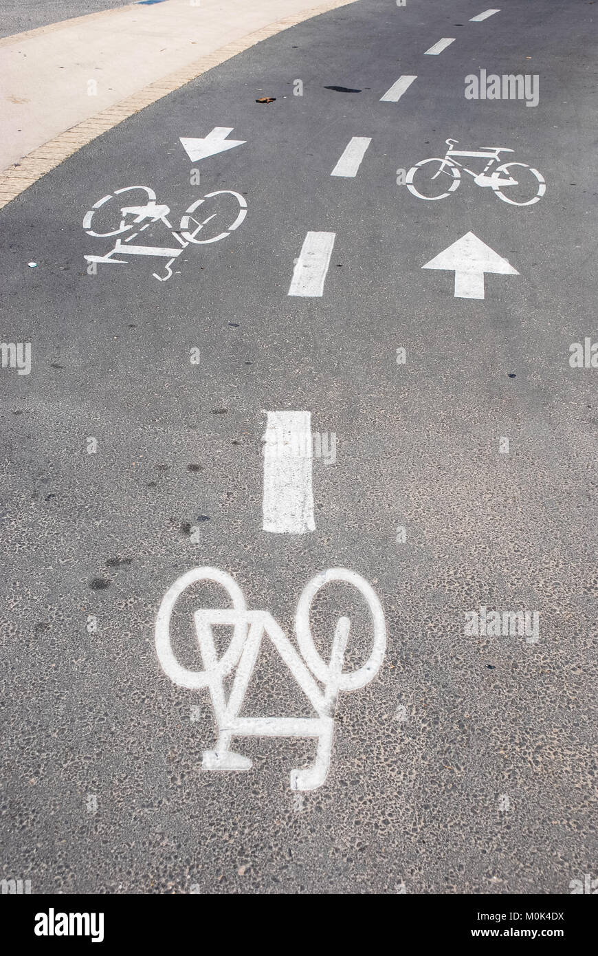 Vertical picture of painted asphalt indicating bicycle rider in Tel ...