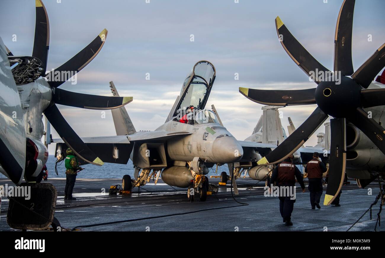 A U.S. Navy F/A-18F Super Hornet jet fighter aircraft prepares to take off the flight deck aboard the U.S. Navy Nimitz-class aircraft carrier USS Carl Vinson January 9, 2018 in the Pacific Ocean. Stock Photo