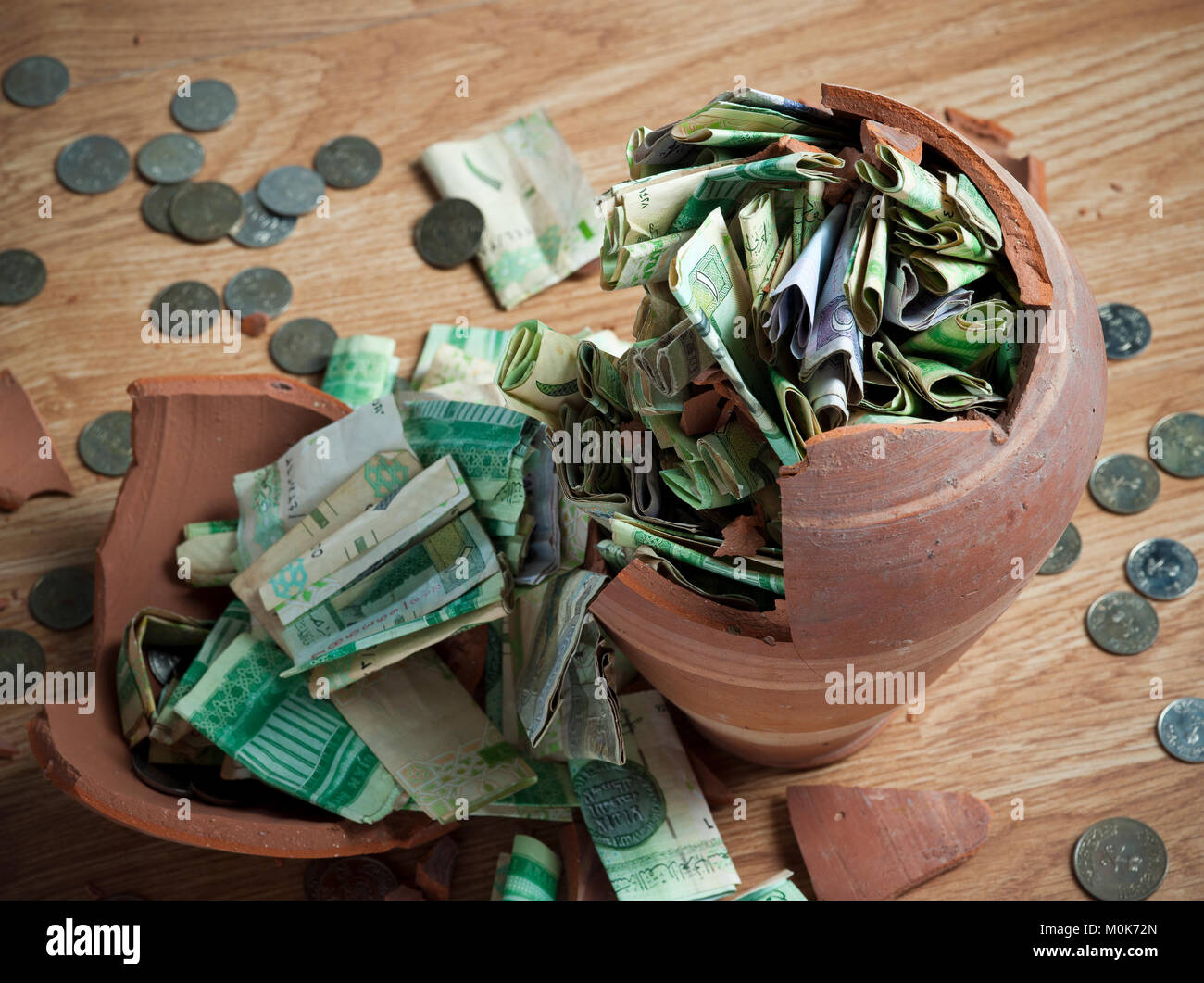 Money box with saudi riyal banknotes Stock Photo
