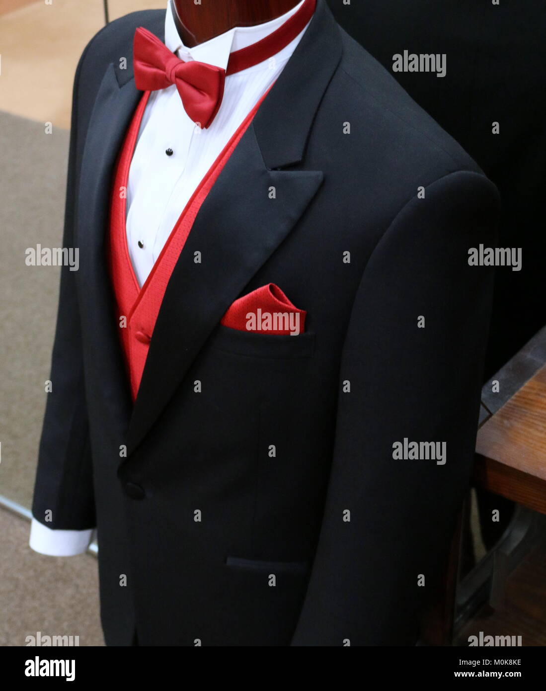 Black Tuxedo With Red Vest And Red Bow Tie Stock Photo - Alamy
