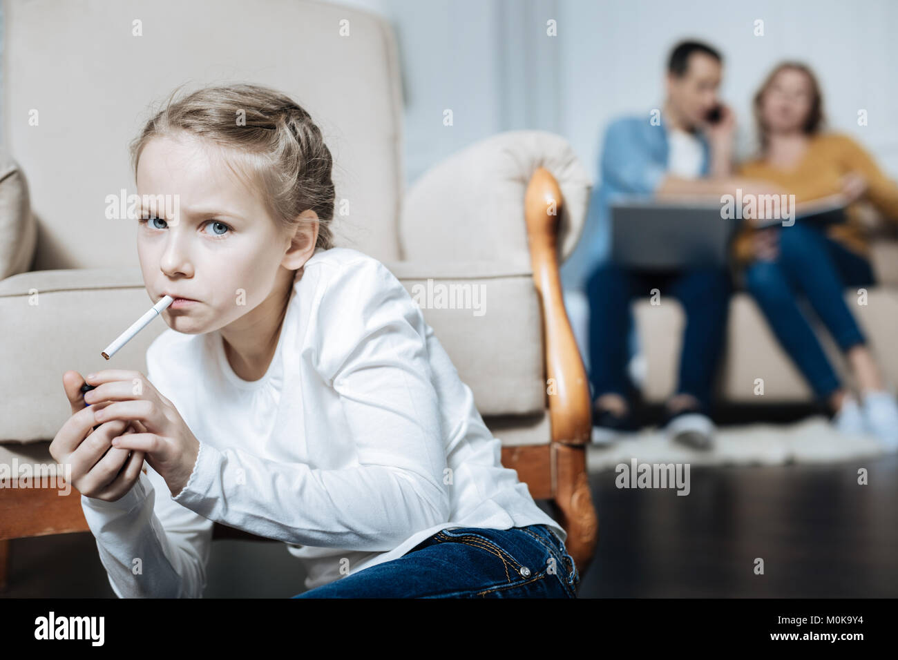 Parent smoking with child hires stock photography and images Alamy