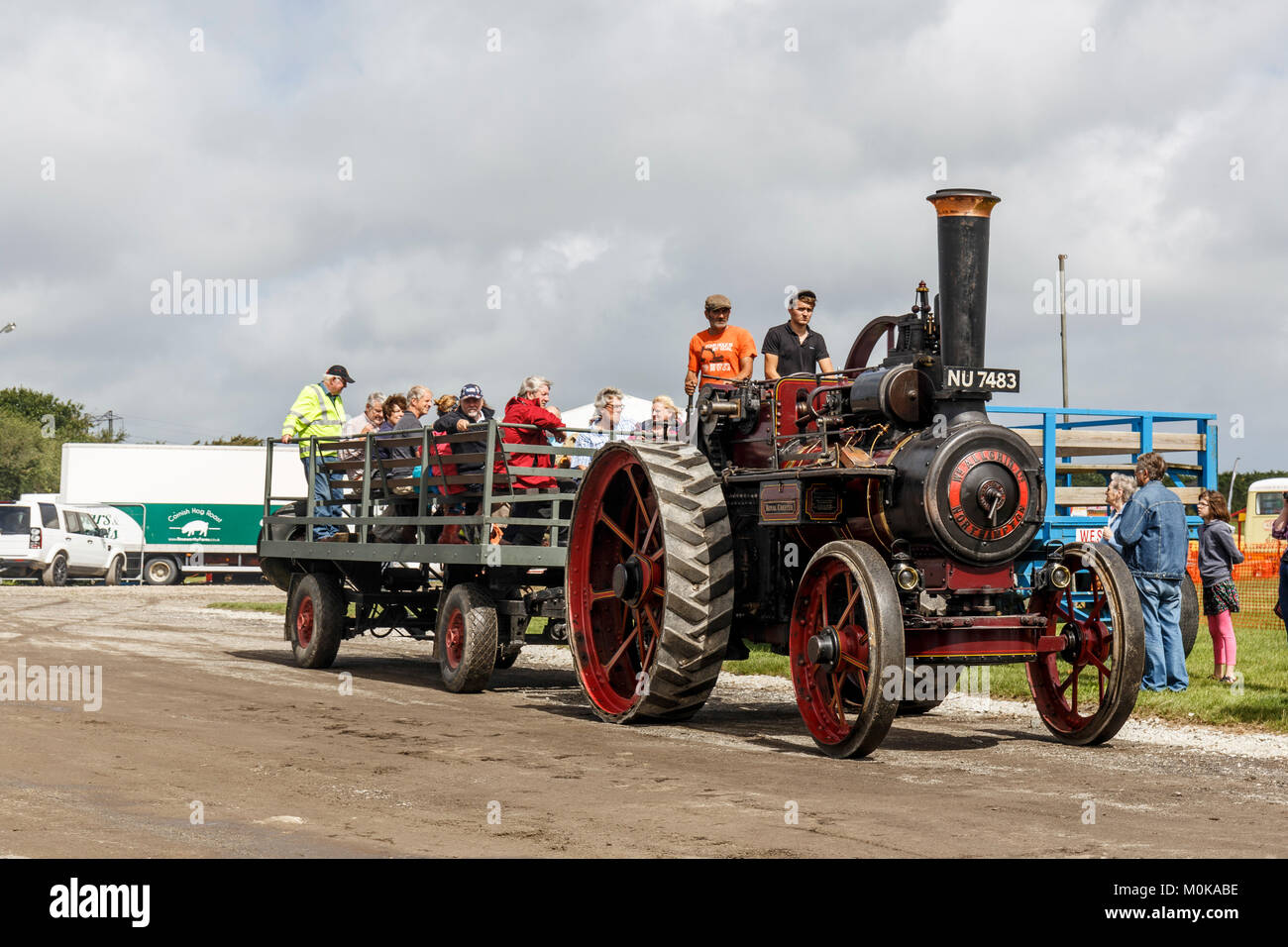 Visitors get a free ride around the show ground behind a classic steam traction engine Stock Photo