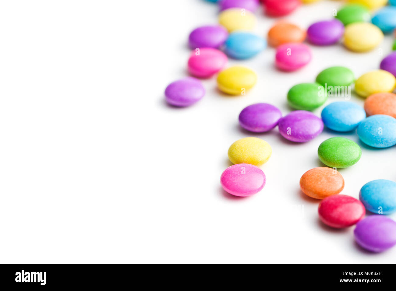 Colorful chocolate candies isolated on white background Stock Photo - Alamy