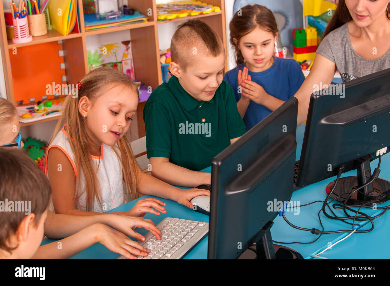 Children computer class us for education and video game Stock Photo - Alamy