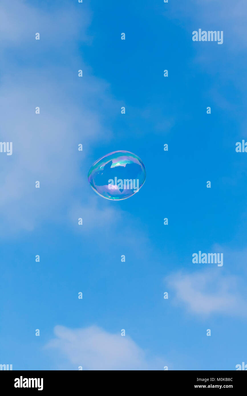 Soap bubble on the background of blue sky with white clouds Stock Photo ...