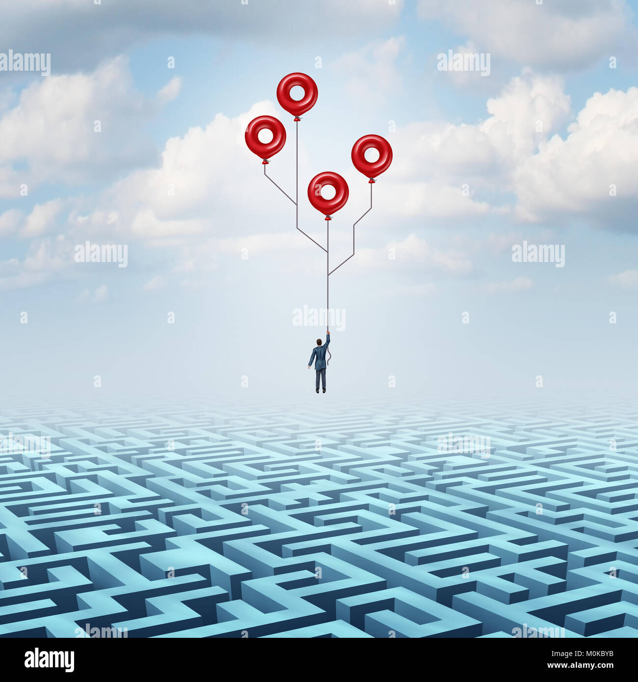 Technology Solution and high tech innovation business metaphor as a businessman holding balloons over a maze shaped as a computer circuit. Stock Photo