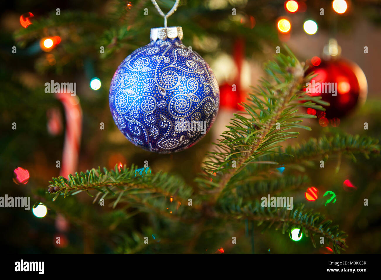 Hand-painted blue Christmas bauble on a Christmas tree; Waco, Texas, United States of America Stock Photo