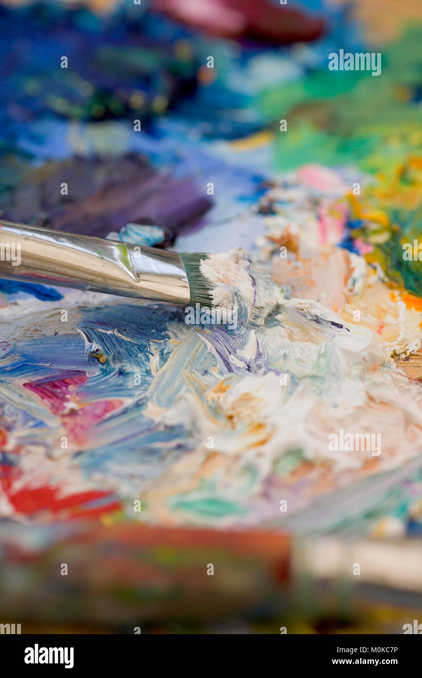 Artists oil paints and brushes multi coloured close up semi abstract Stock Photo