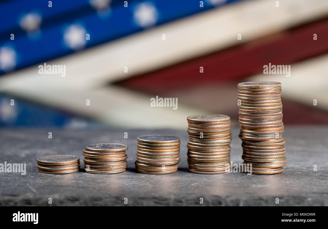 Pile of US quarters growing with compound interest Stock Photo