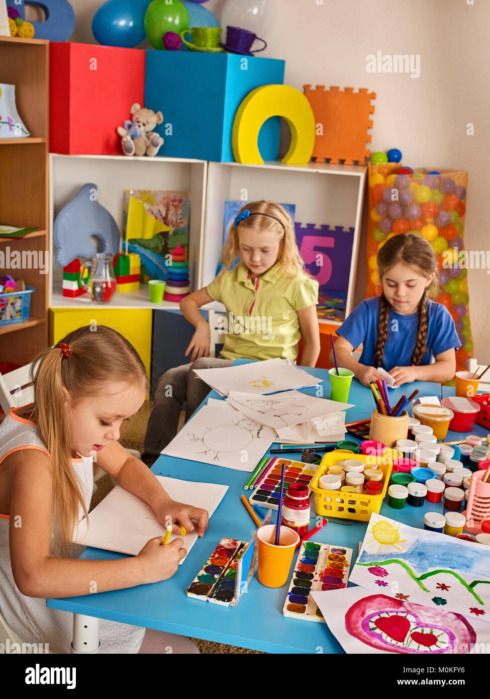 Small students children painting in art school class Stock Photo - Alamy