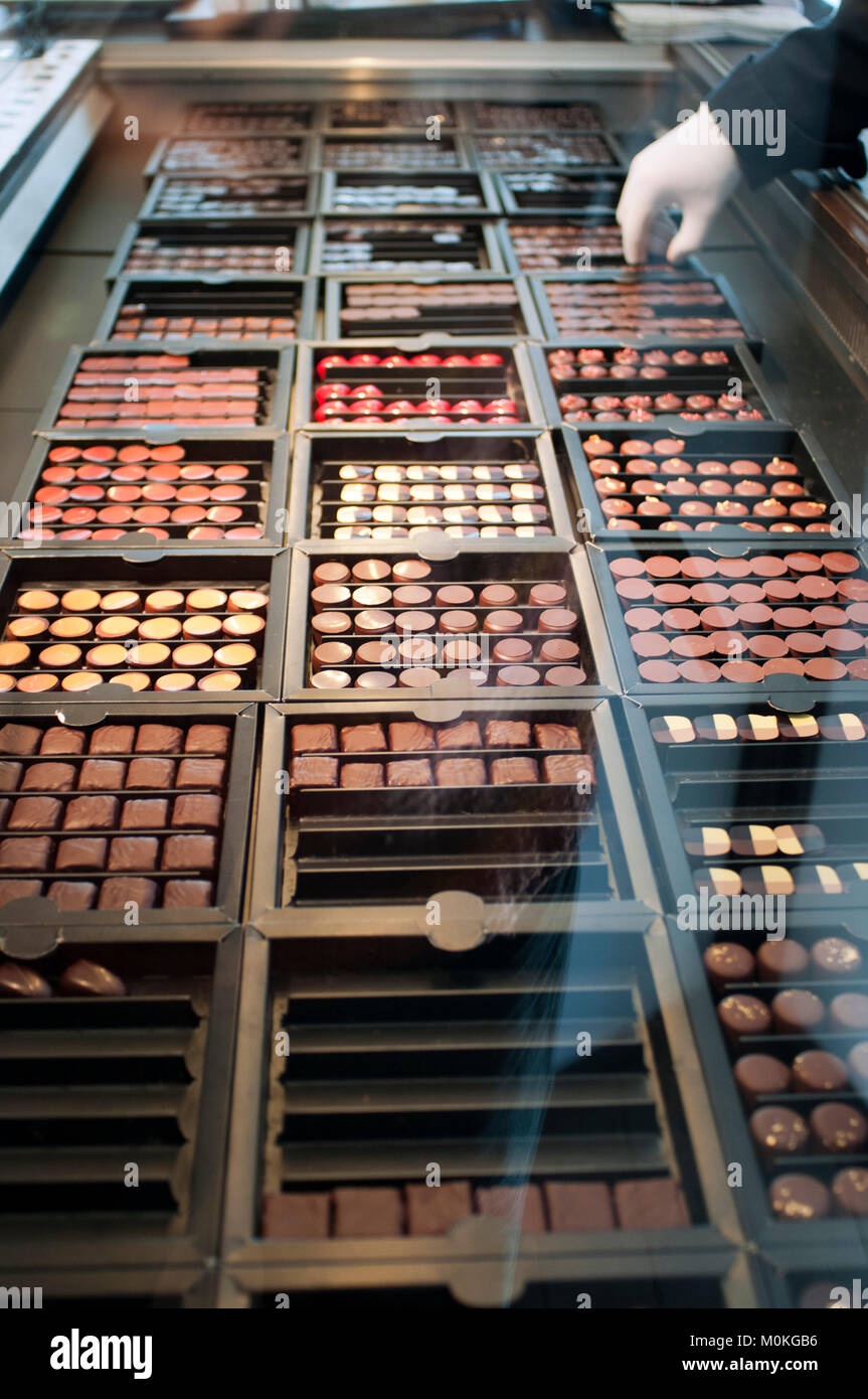 Huge choice and range of luxury Belgian chocolates displayed for sale at popular shop Pierre Marcolini in Brussels, Belgium. Stock Photo