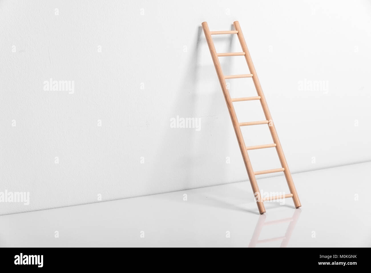 Wooden ladder leaning against the wall Stock Photo Alamy