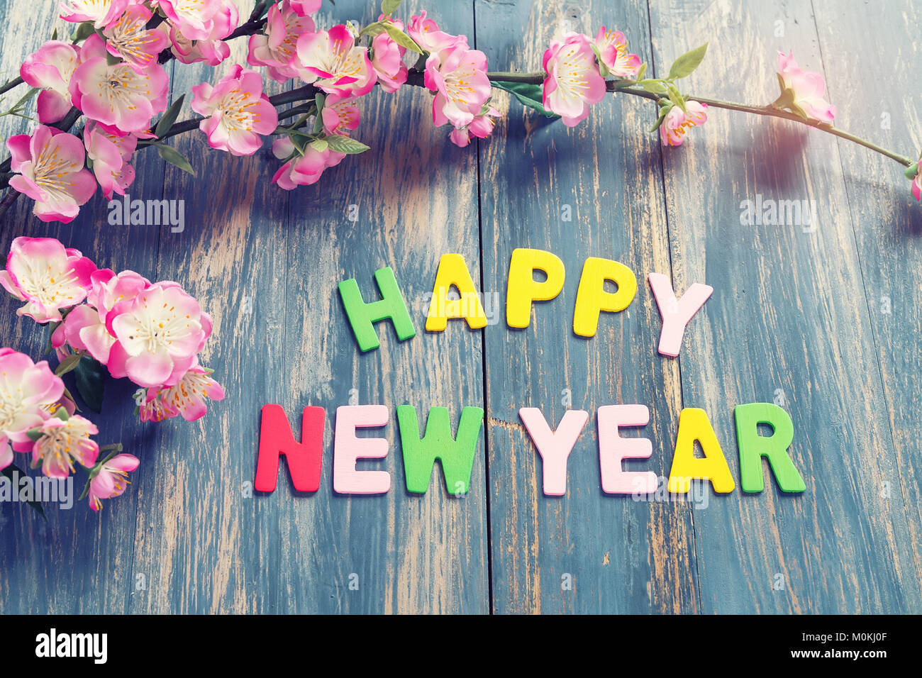 letter HAPPY NEW YEAR on wood texture background Stock Photo - Alamy