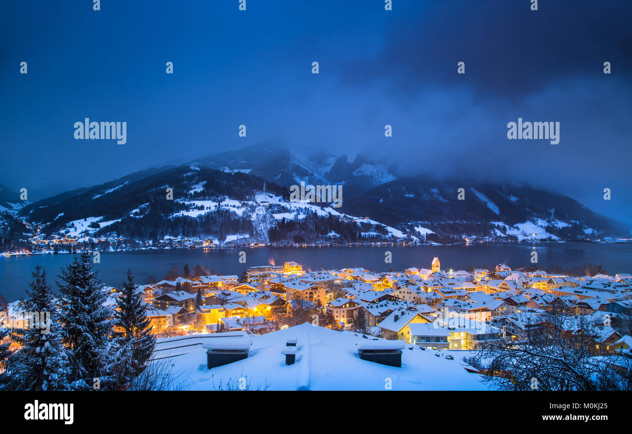 Panoramic view of Zell am See with Zeller See lake in twilight during blue hour at dusk in winter, Salzburger Land, Austria Stock Photo