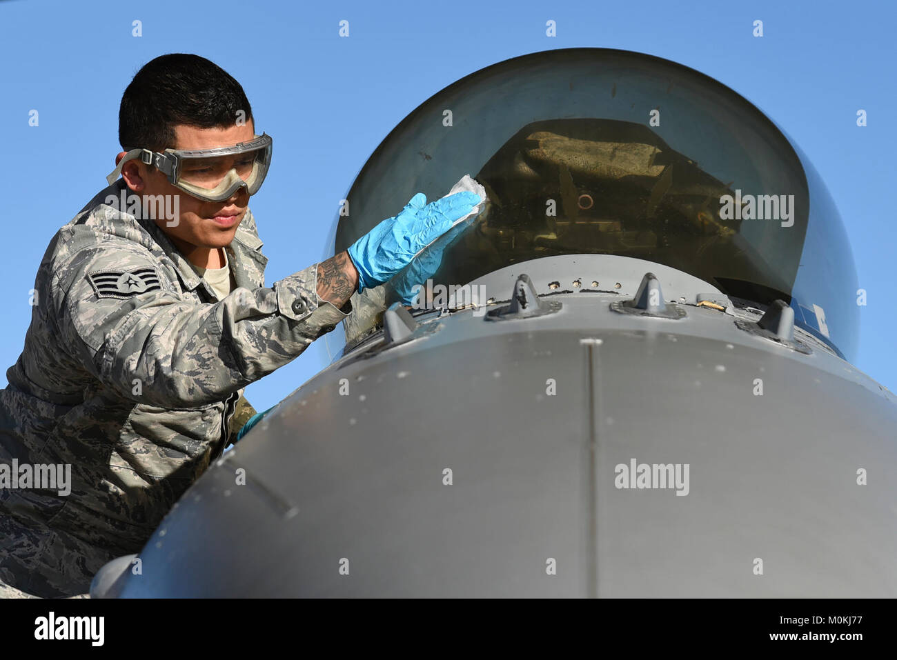 U.S. Air Force Staff Sgt. Pedro Cahua, 20th Aircraft Maintenance Squadron, 79th Aircraft Maintenance Unit, dedicated crew chief, cleans the canopy of an F-16CM Fighting Falcon before judges review the aircraft for a Proud Falcon Competition at Shaw Air Force Base, S.C., Dec. 21, 2017. The annual competition gave one dedicated crew chief from each of the squadron’s three units a chance to compete head-to-head to determine which performed the best. (U.S. Air Force Stock Photo