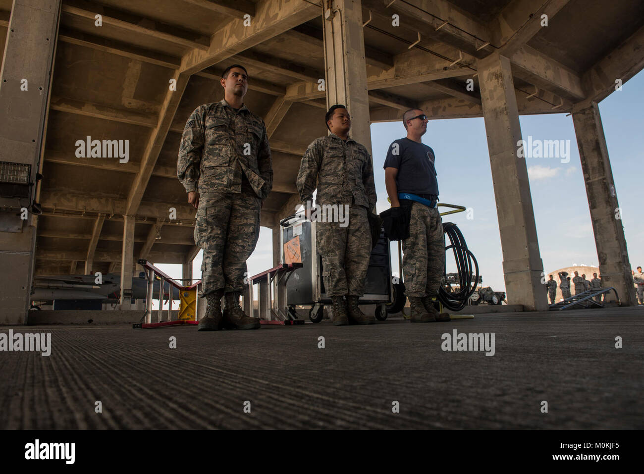 U.S. Air Force Airmen from the 44th Aircraft Maintenance Unit, stand at ...