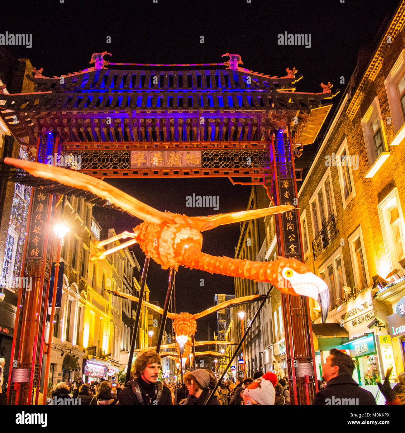 'Flying' Flamingo's operated by puppeteers in Chinatown during the Lumiere Light Festival, London. Stock Photo