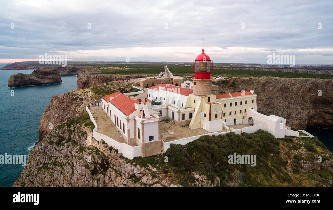 View of the lighthouse and cliffs at Cape St. Vincent at sunset ...