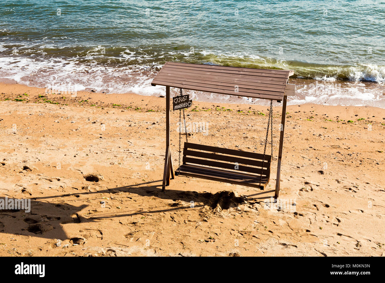 Just Married bench on Qingdao beach in Taiping bay, used for wedding pictures. Qingdao, Shandong province, China Stock Photo