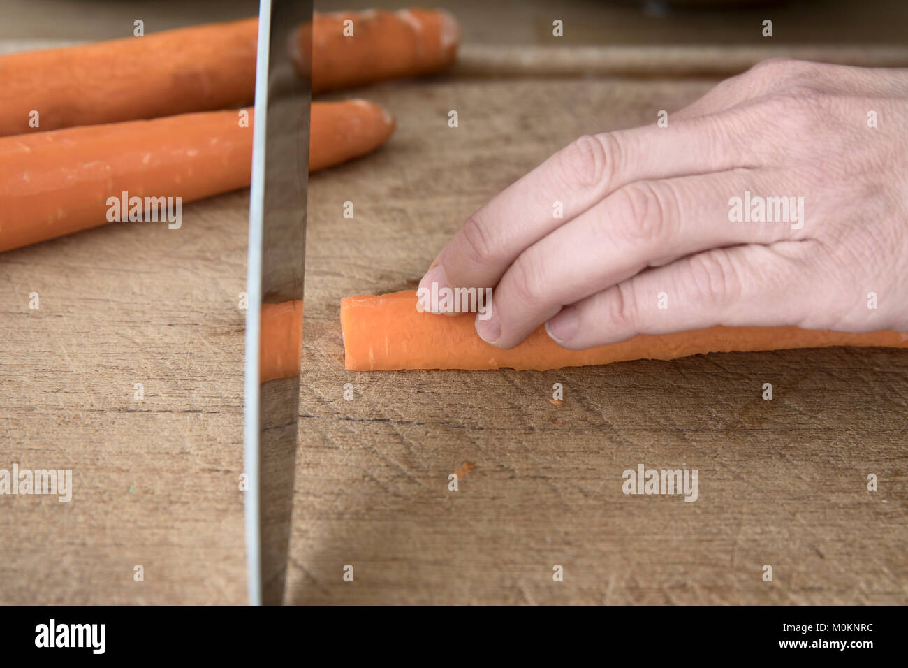 Knife skills cutting a carrot the wrong way to hold your fingers when