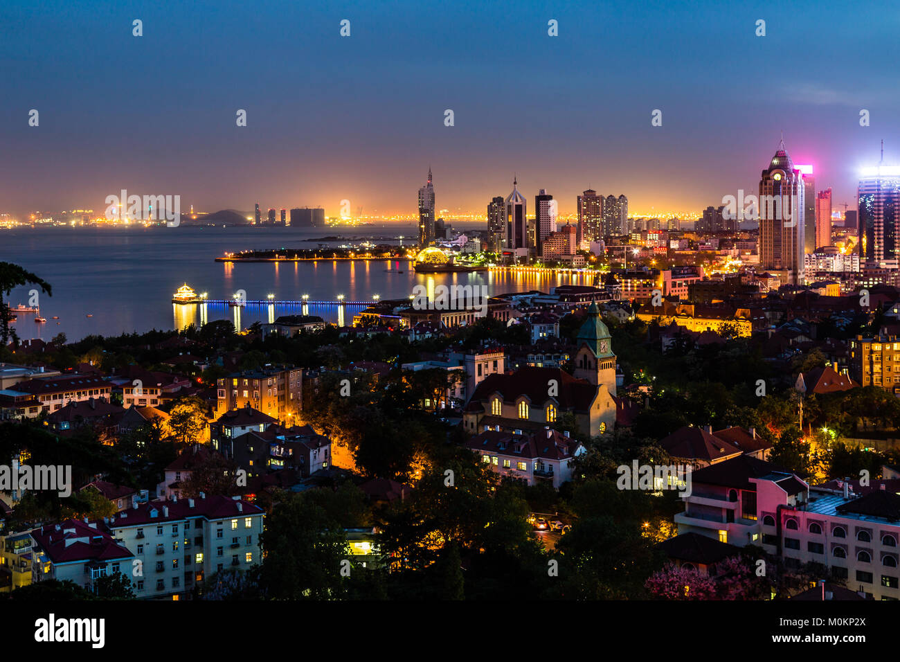 Qingdao Bay and the Lutheran church seen from the hill of Signal Park