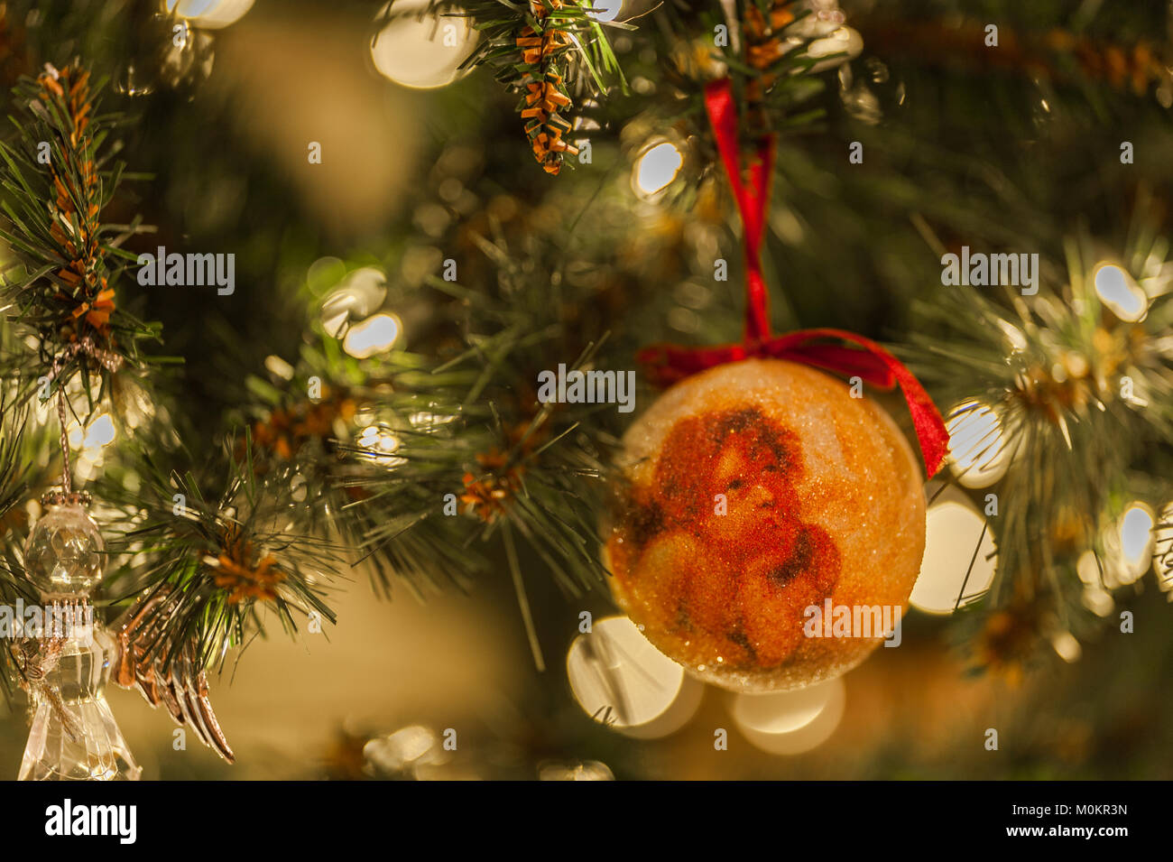 Christmas decoration on a Christmas tree with lights and copy space. Stock Photo