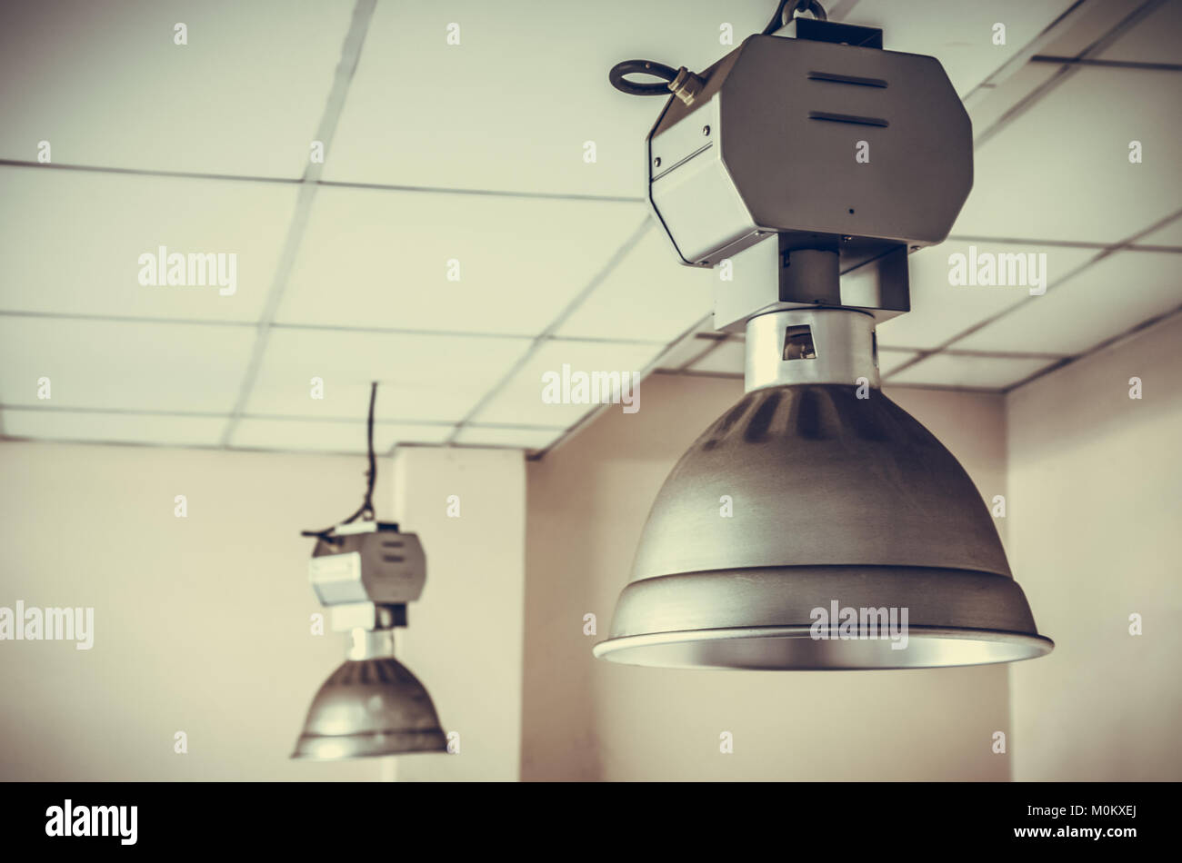 dirty industrial lamp, High Bay Lighting. vintage photo and film style Stock Photo