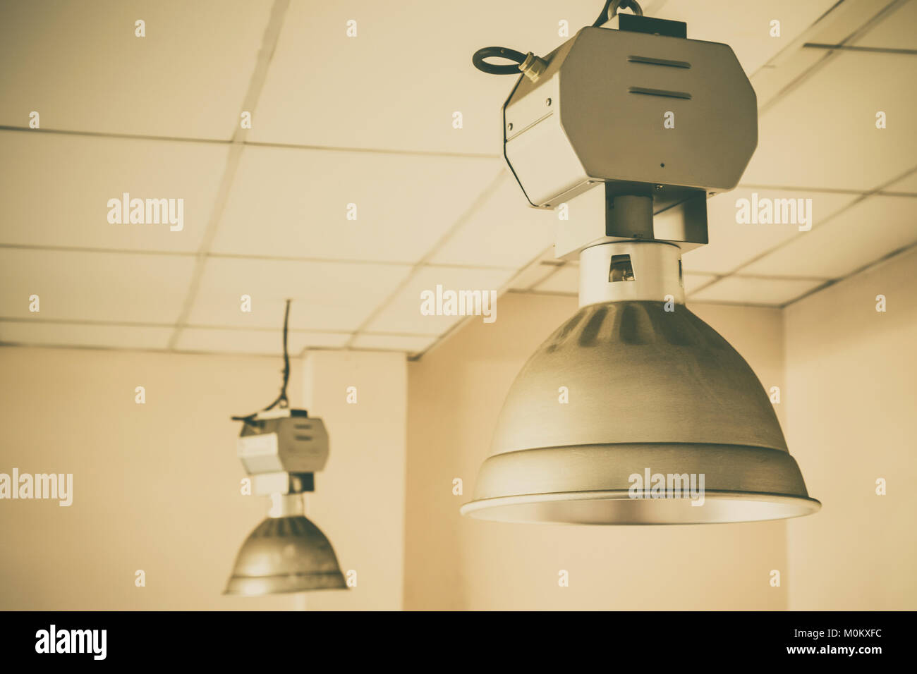 dirty industrial lamp, High Bay Lighting. vintage photo and film style Stock Photo