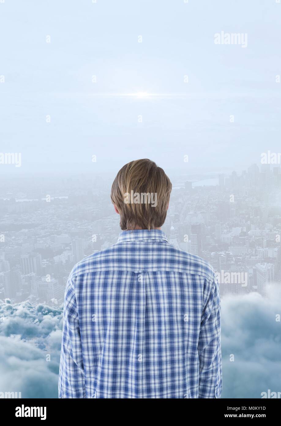 Man looking across skyline with smoke in front of him Stock Photo