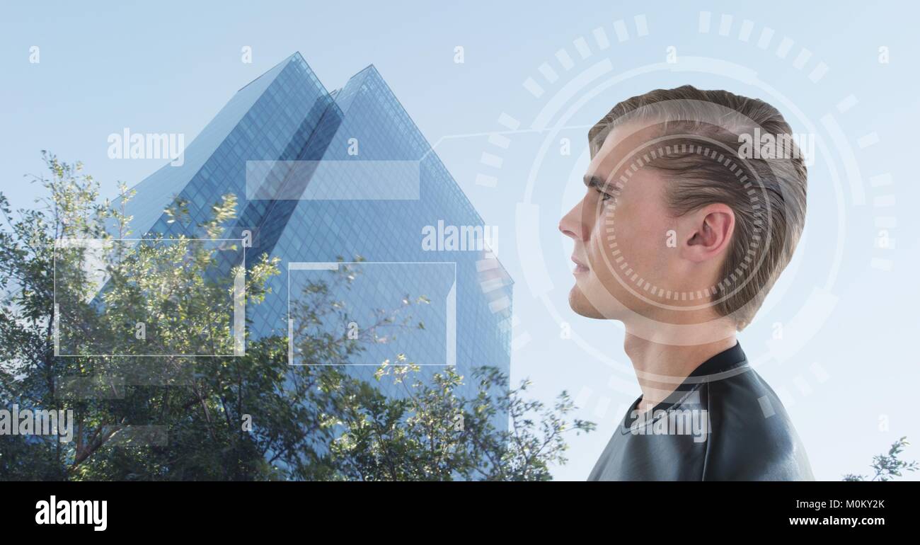 Man looking at building with interfaces over head Stock Photo