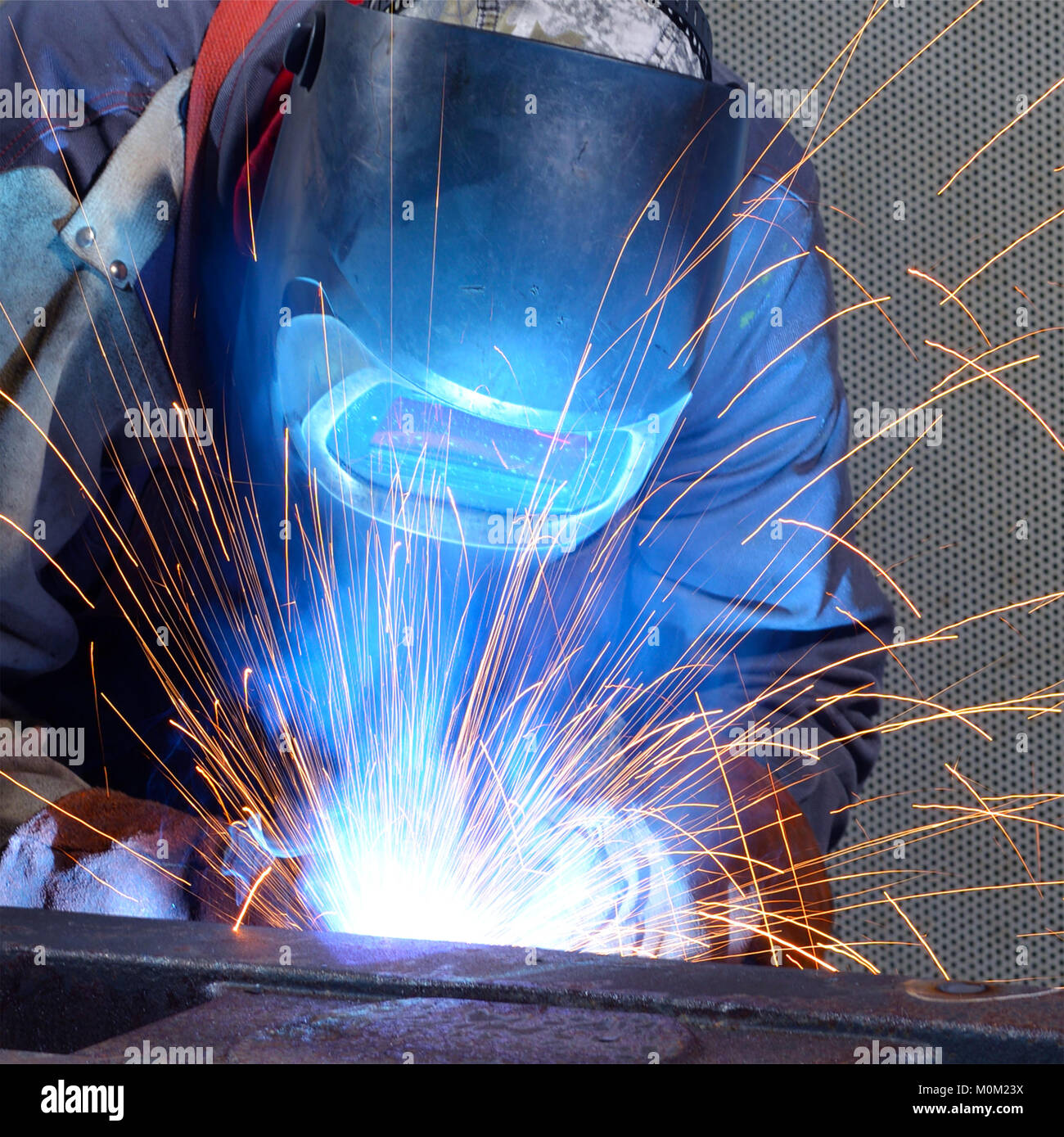 welder works in an industrial company production of steel components