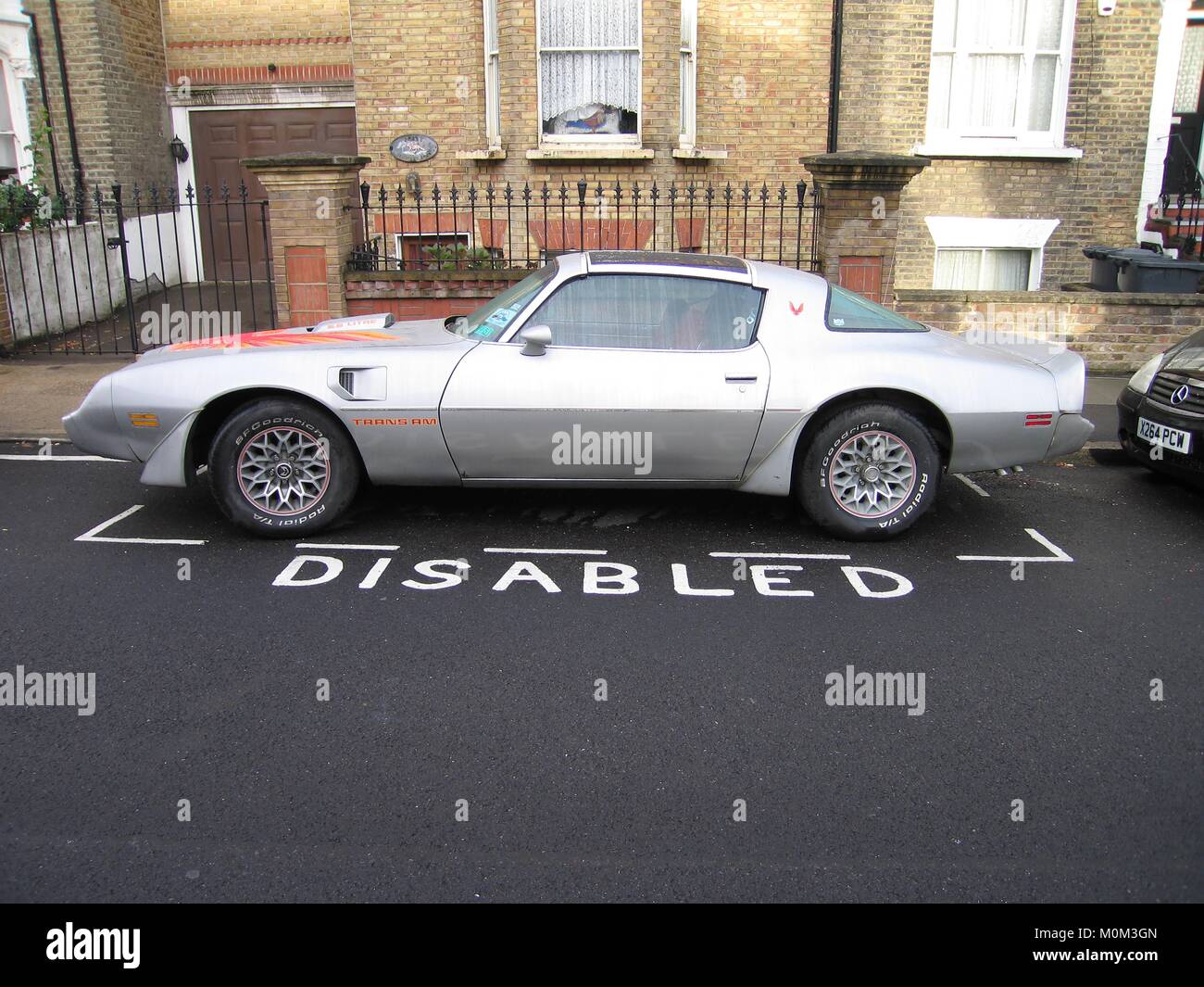 Pontiac Firebird Trans Am in a disabled parking bay in London, England, Britain Stock Photo