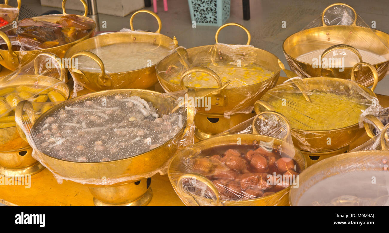 Shiny Brass Bowls filled with food ready for lunch Stock Photo
