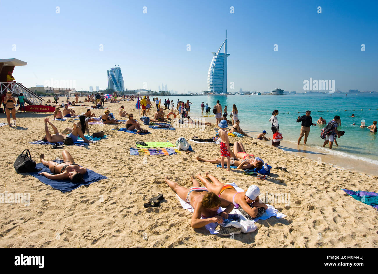 DUBAI, UNITED ARAB EMIRATES - JAN 02, 2018: Public beach of Dubai near the Burj Al Arab hotel. Stock Photo