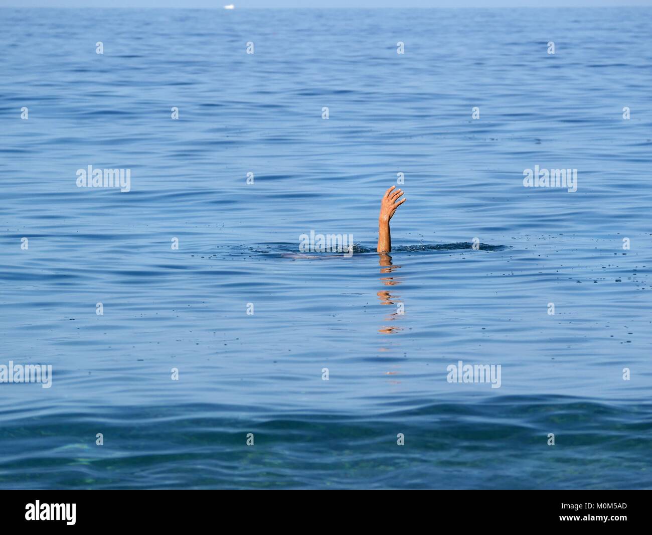 hand of woman doing yogic exercises in the sea Stock Photo