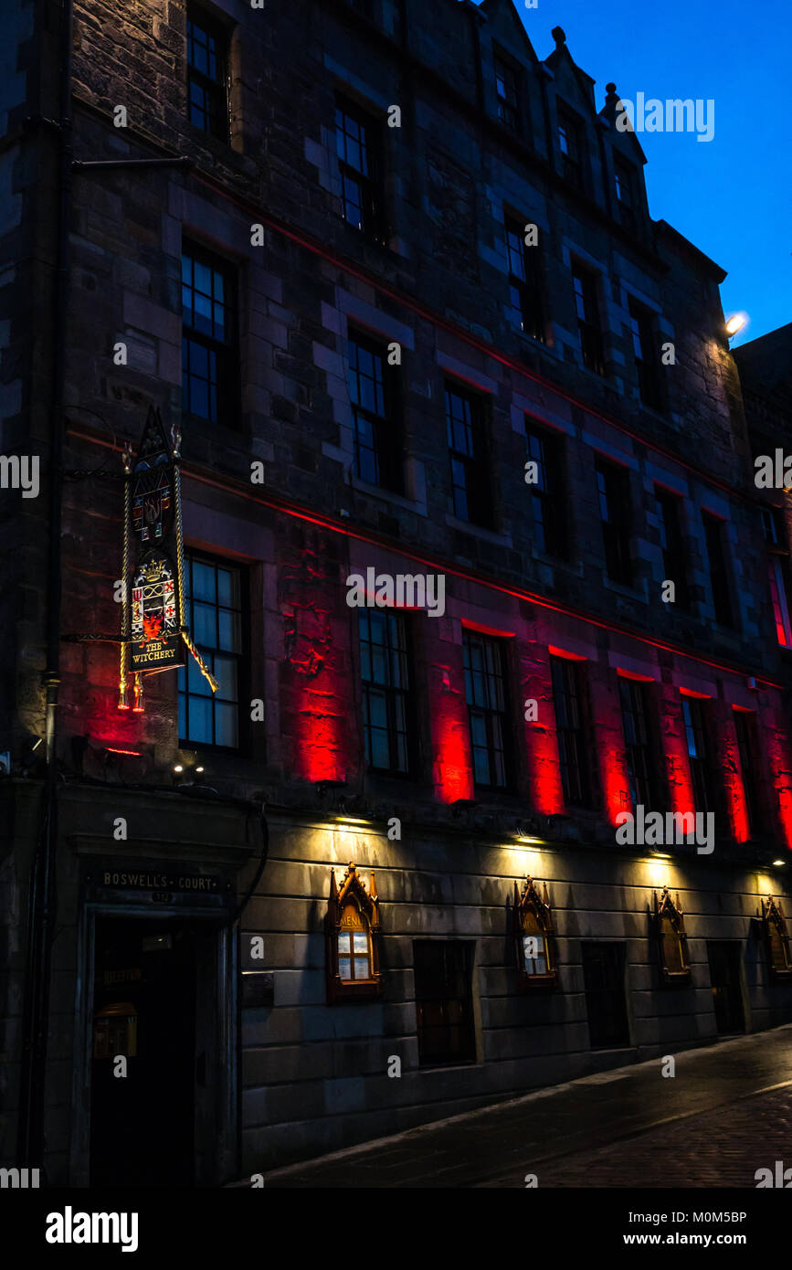 Dramatic red night lights and sign of The Witchery restaurant, 16th century Boswell's Court, Castlehill, Royal Mile, Edinburgh, Scotland, UK Stock Photo