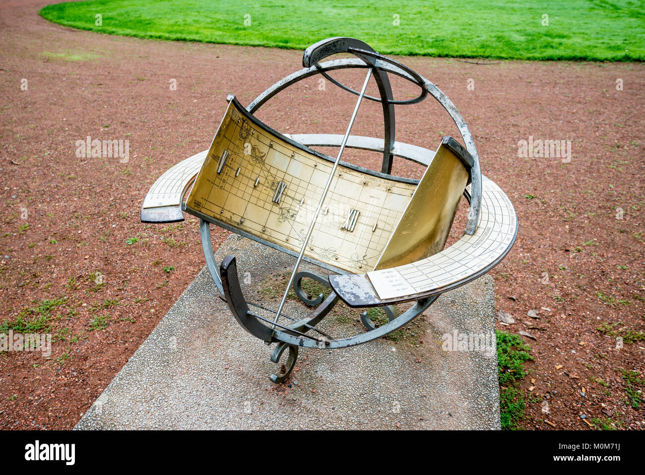 sundial. old sun clock dial in a garden Stock Photo Alamy
