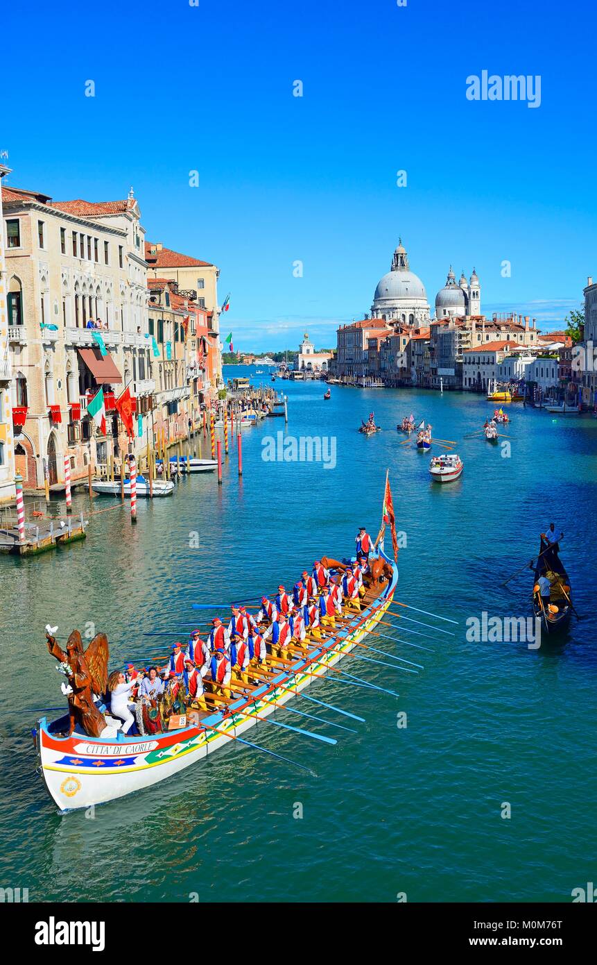 Italy,Veneto,Venice listed as World Heritage by UNESCO,the historical regatta on the Grand Canal with Cavalli Franchetti palace on the left and Santa Maria Della Salute church in the background Stock Photo