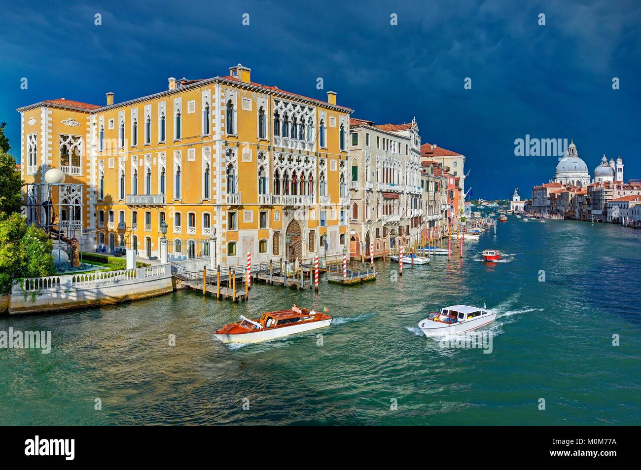 Italy,Veneto,Venice listed as World Heritage by UNESCO,the Grand Canal with the Cavalli Franchetti palace on the left and Santa Maria Della Salute church in the background Stock Photo