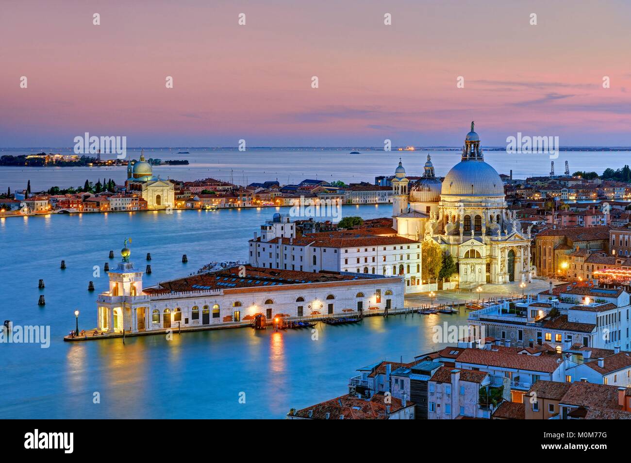 Italy,Veneto,Venice listed as World Heritage by UNESCO,the Grand Canal on the foreground,Punta Della Dogana (Customs Point) where is located the François Pinault Foundation and Santa Maria Della Salute basilica Stock Photo