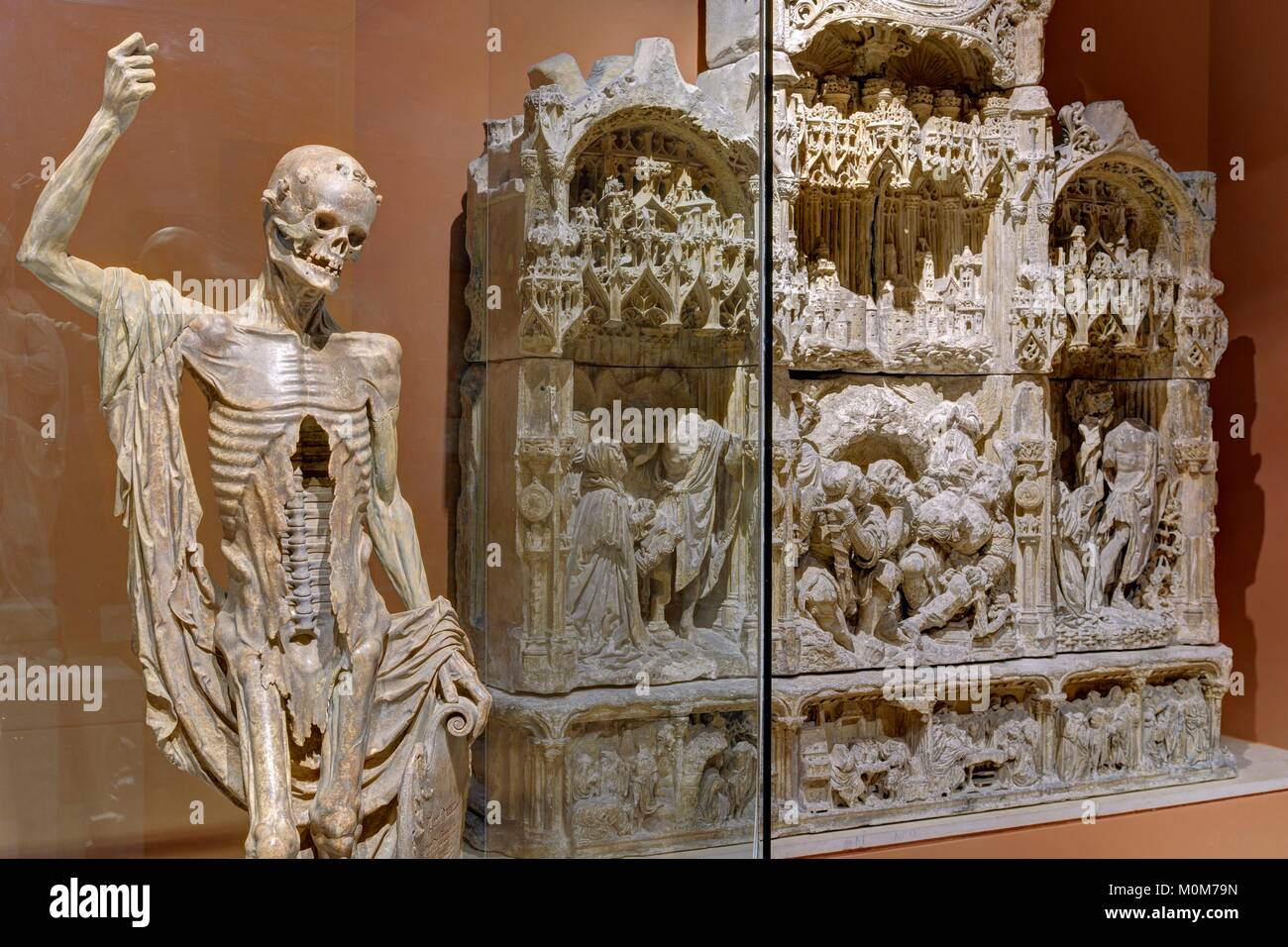 France,Paris,area listed as World Heritage by UNESCO,Louvre museum,french sculptures department,early XVIth century artworks room. La mort Saint Innocent: sculpture made of alabaster in 1530 coming from the Innocents cemetery and retable of Champagne depicting the Resurrection of Christ Stock Photo