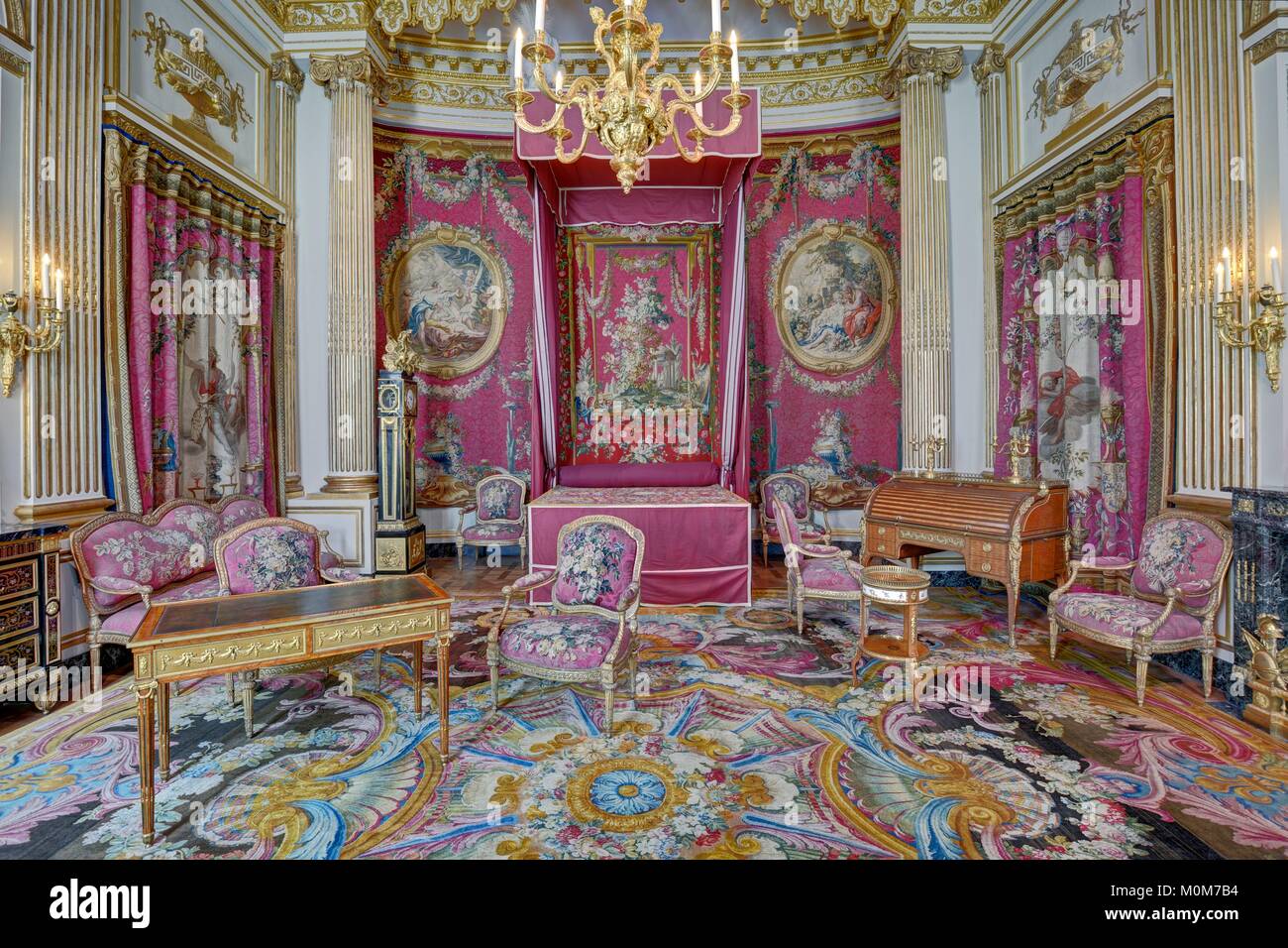 France,Paris,area listed as World Heritage by UNESCO,Louvre museum,decorative arts and furniture department,Luynes mansion room,with the woodworks of Luynes mansion made in 1766,tapestries of the Gobelins woven in 1769 for the Bourbon palace and carpet of queen Marie Lecinzka in Versailles woven in the manufactory of La Savonnerie in 1740 Stock Photo