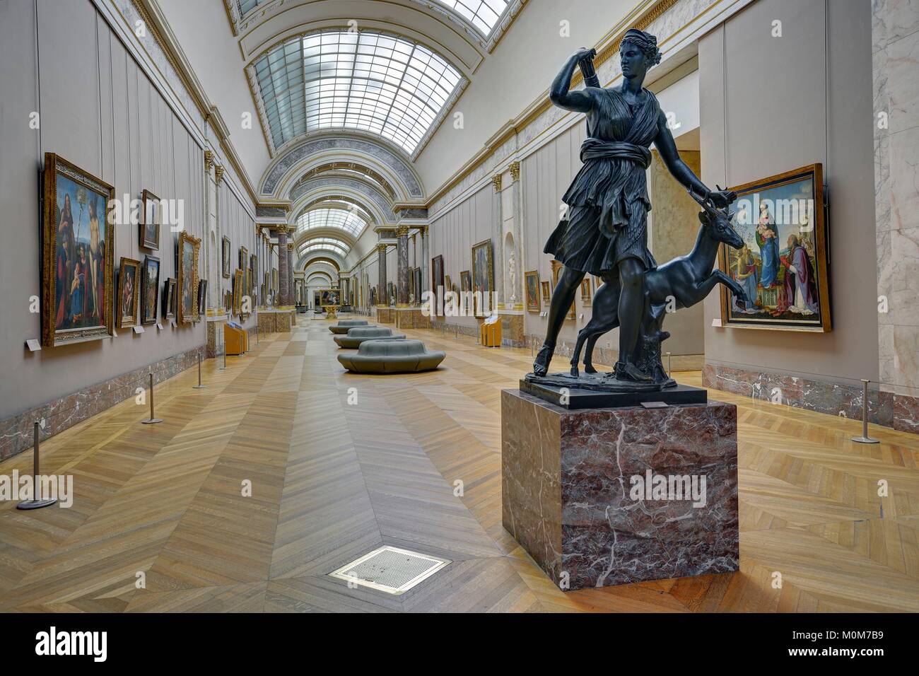 France,Paris,area listed as World Heritage by UNESCO,Louvre museum,italian paintings department,the grand gallery with in the foreground the replica of the ancient sculpture Diana of Versailles Stock Photo
