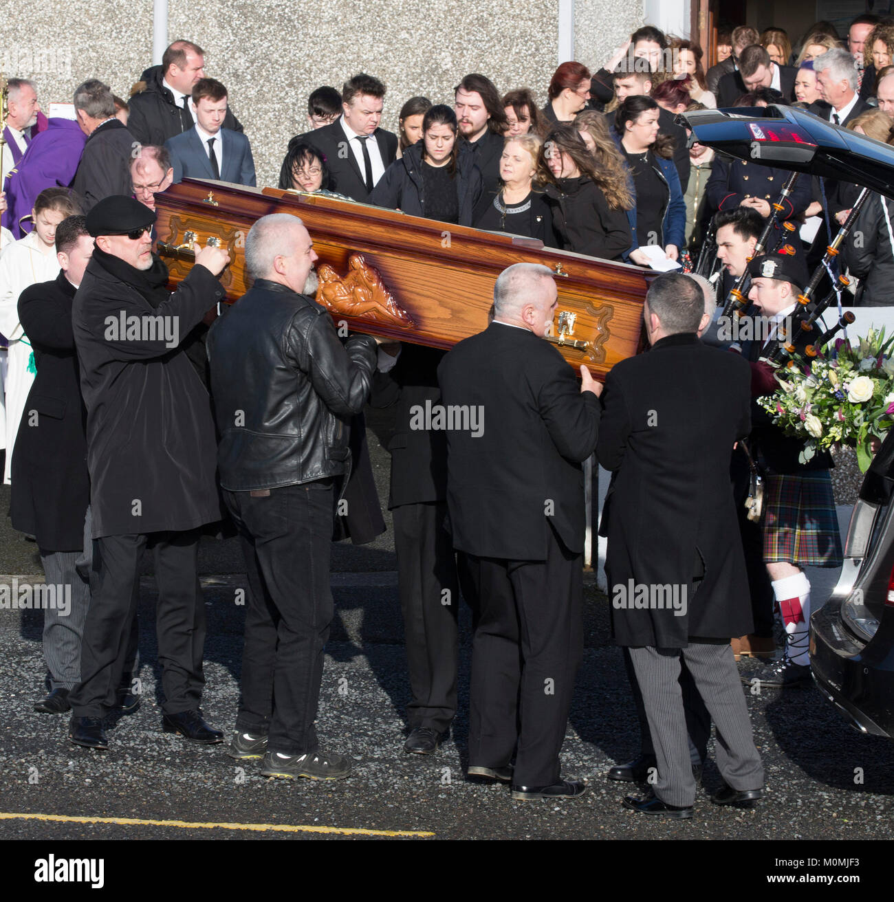 Limerick, Ireland. 23rd Jan, 2018. People carry the coffin bearing the