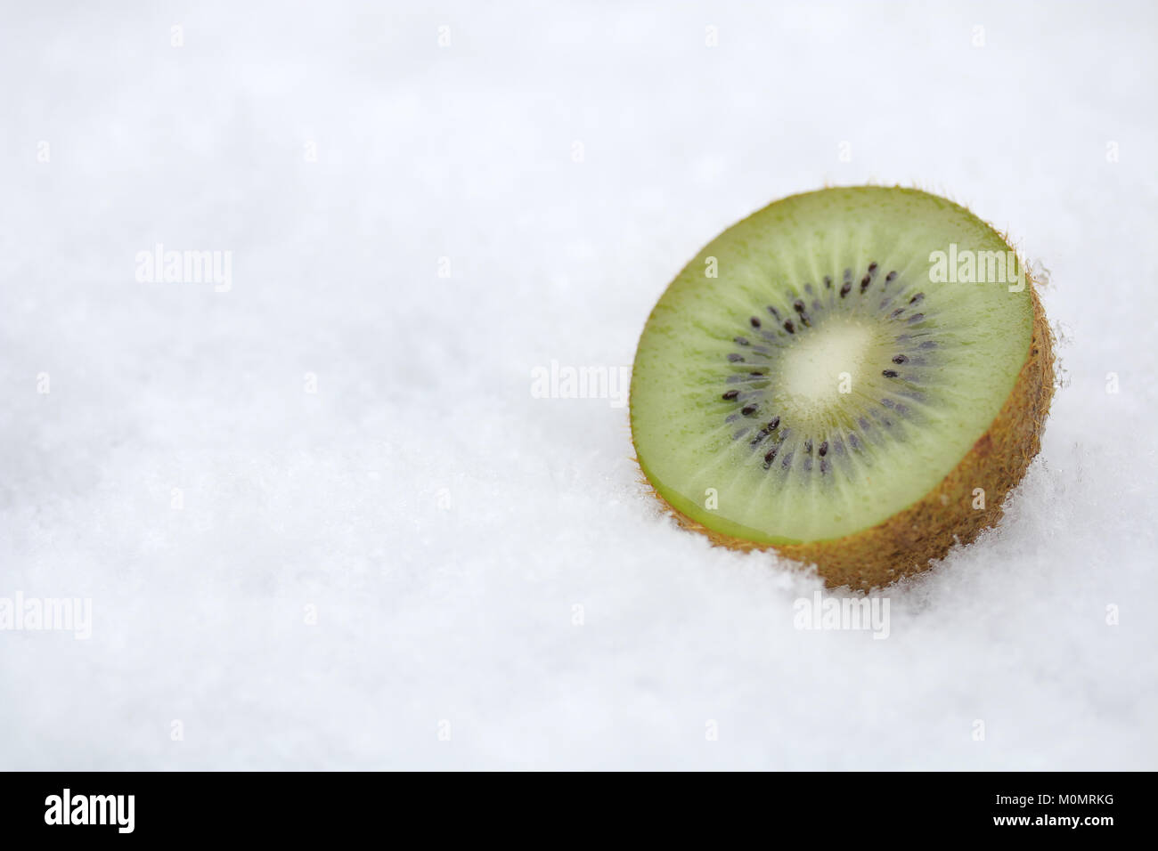 kiwi fruit on cold winter snow background Stock Photo Alamy