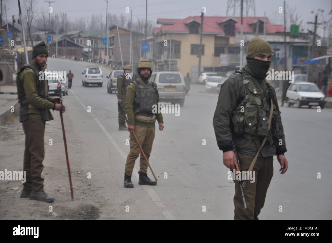 Policemen stand guard in Anantnag, Kashmir on January 23, 2018, ahead of Indian Republic Day on January 26. Stock Photo