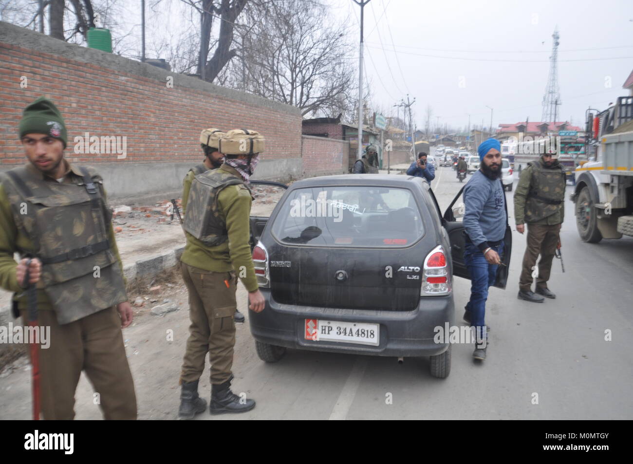 Policemen check a vehicle in Anantnag, Kashmir on January 23, 2018, ahead of Indian Republic Day on January 26 Stock Photo