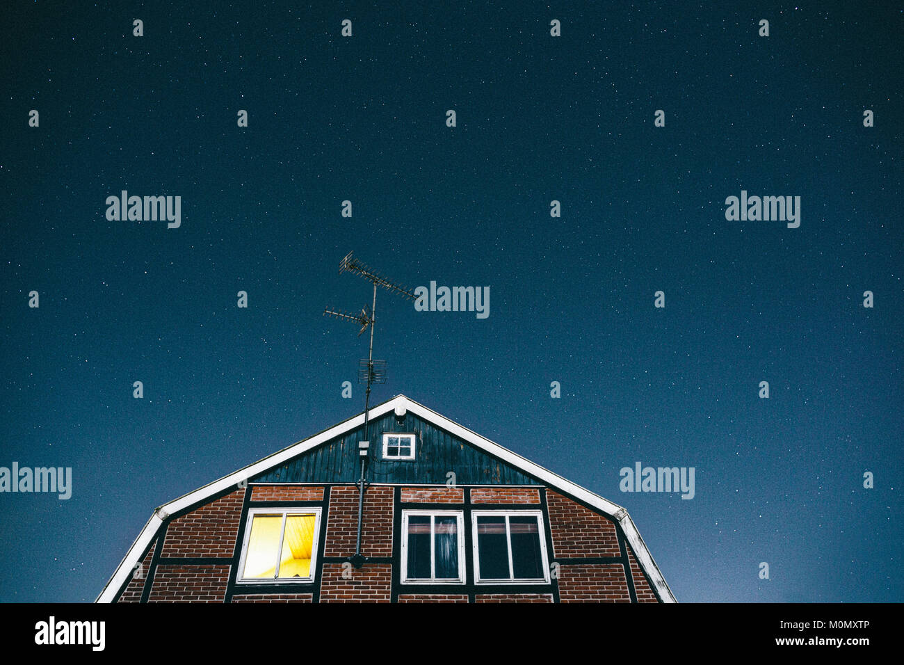 A house photographed at night when most people sleep under the stars ...