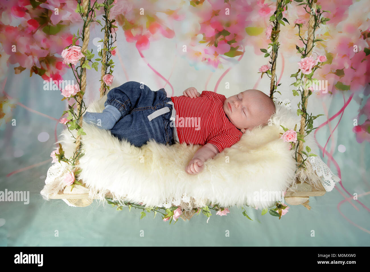 7 week old baby boy sleeping on swing bed Stock Photo Alamy